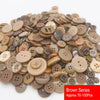 A pile of assorted brown resin sewing buttons for crafting and DIY projects.