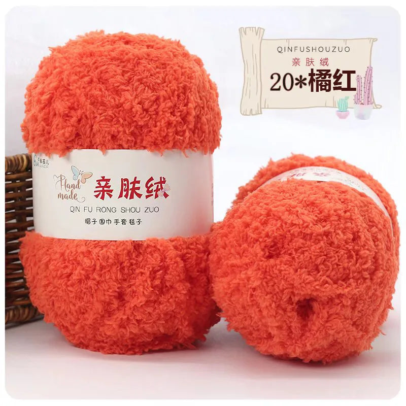 A bright orange fluffy yarn ball labeled as Plant made QIN FU RONG SHOU ZUO for crafting.