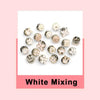 A collection of white pearl brooch buttons in various shapes and sizes.