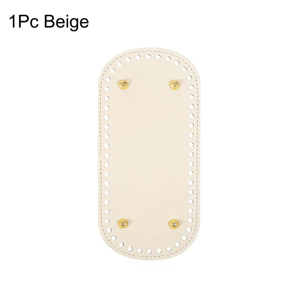 One beige reusable PU leather bag bottom pad with decorative stitching and metal grommets.