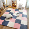 A pink, white, and navy checkered foam play mat for babies and toddlers placed on a wooden floor.