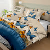 A set of butterfly print brushed duvet cover and pillowcases in blue, orange, and cream tones.
