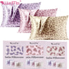 Three satin pillowcases in leopard print featuring various shades of pink and beige.
