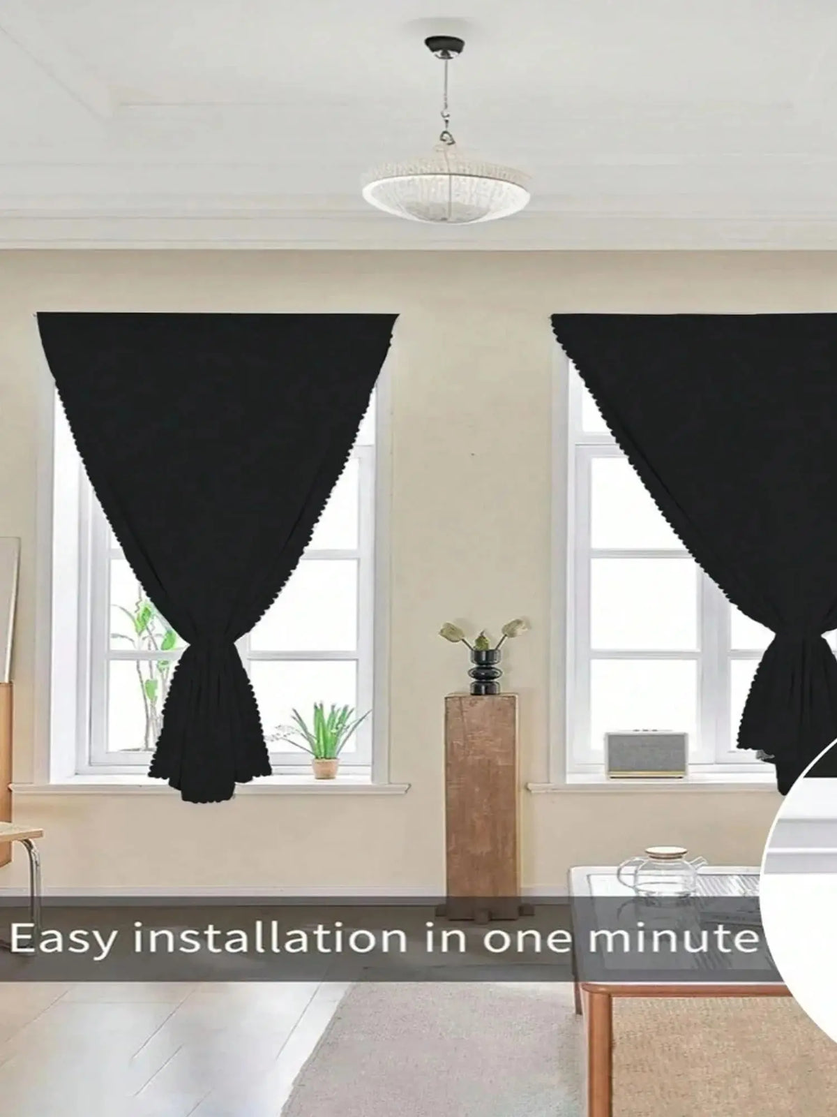 Blackout window curtains are installed in a window frame with sheer white curtains visible.