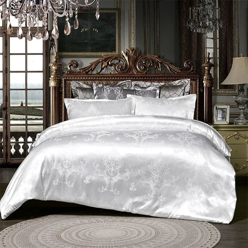 A luxurious white satin duvet cover set displayed on a bed with an ornate wooden headboard and antique lighting.