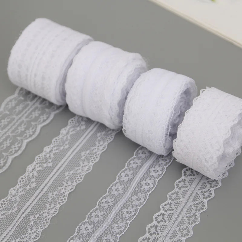 Rolls of white floral lace ribbon cotton trim for sewing and crafts