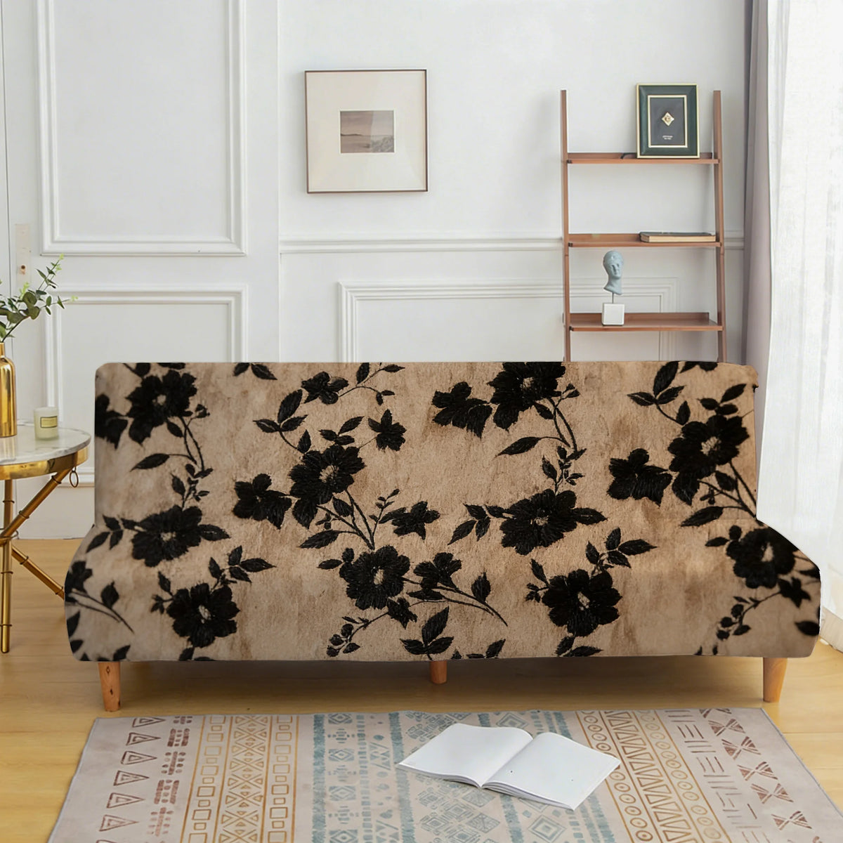 A tan velvet sofa cover with a black floral pattern displayed on a wooden frame.