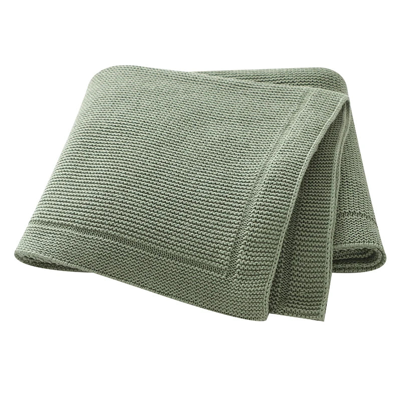 A folded, olive green all-season cotton baby swaddle blanket.
