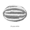 A round ball knitted with alternating gray and white stripes.