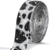 Roll of clear rhinestone sticker ribbon with a black leopard print pattern
