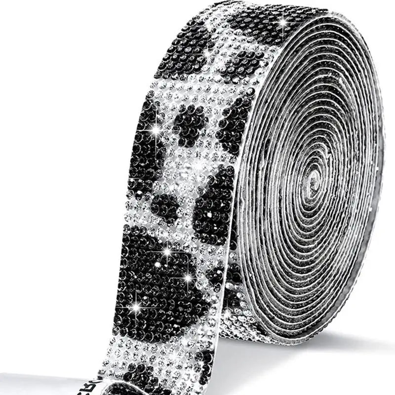 Roll of clear rhinestone sticker ribbon with a black leopard print pattern