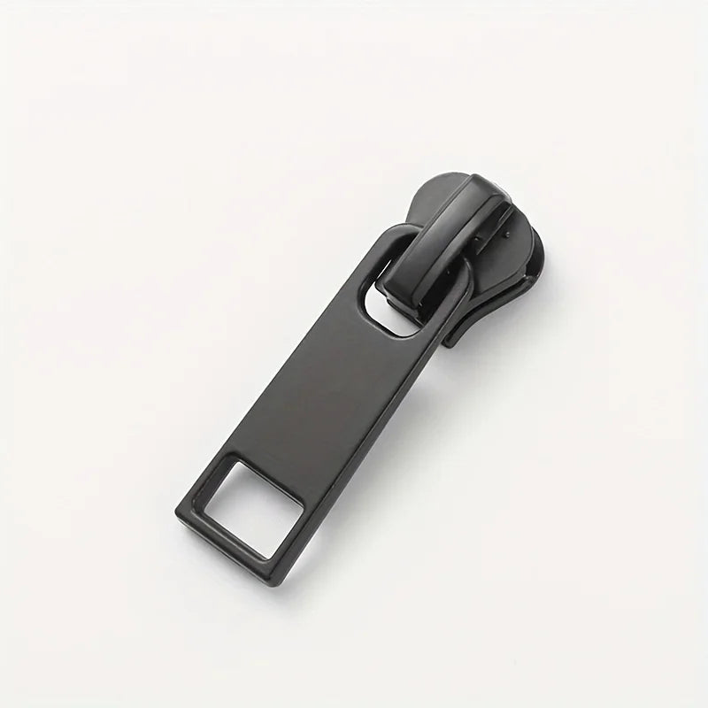 A black universal replacement zipper slider for clothing.
