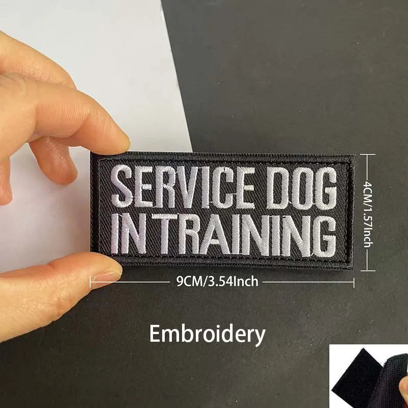 Black embroidered patch with white text Service Dog in Training