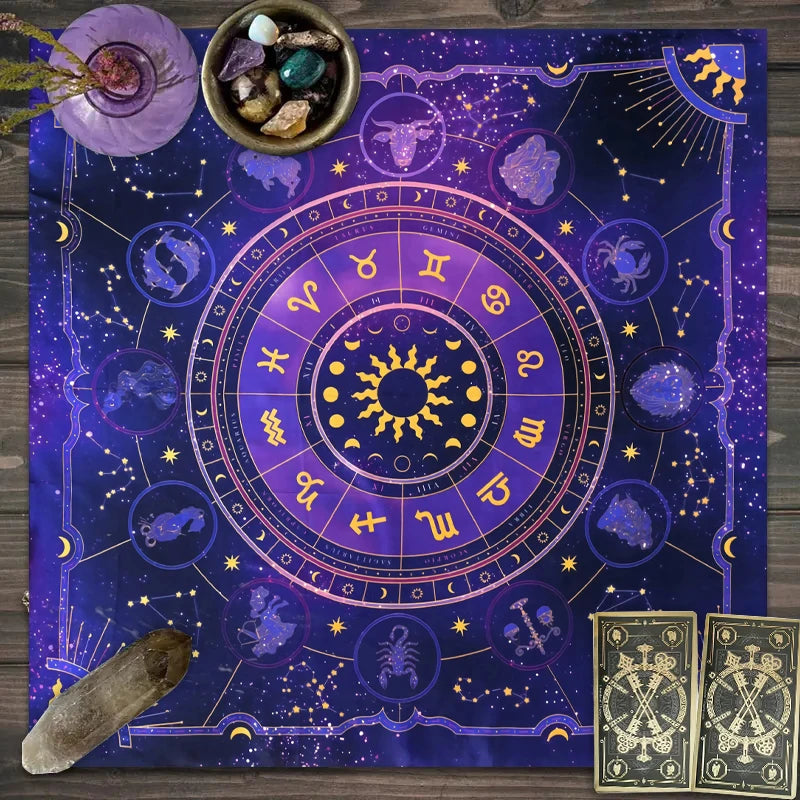 A dark blue tarot card tablecloth featuring a celestial zodiac wheel and mystical symbols.