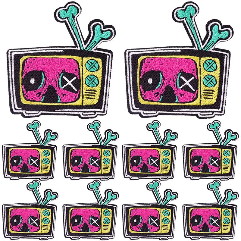 A set of DIY punk embroidery patches featuring skulls and crosses on a television shape.
