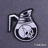 Black and white embroidered patch of a skull in a pitcher design