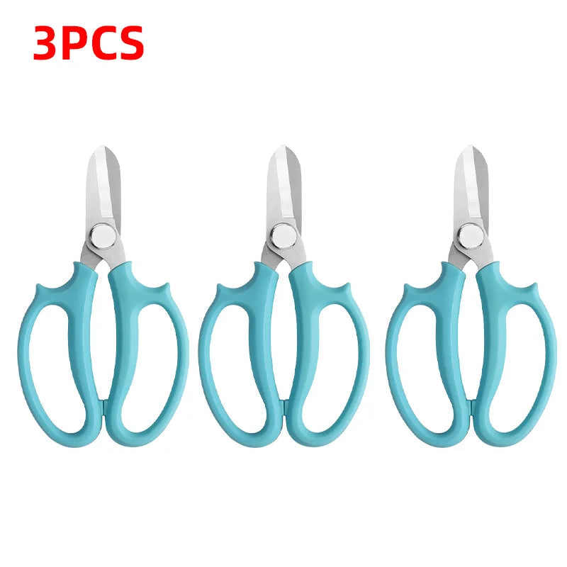 Three pairs of light blue precision shears for bonsai and floral work