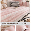 Pink plush sofa cover with gray stripes and decorative pillows