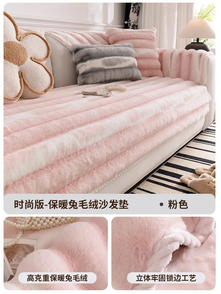 Pink plush sofa cover with gray stripes and decorative pillows