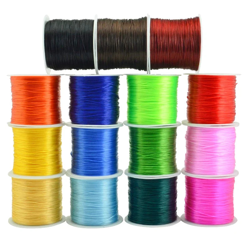 A collection of multicolored elastic beading cords in various colors including black, brown, red, blue, green, orange, yellow