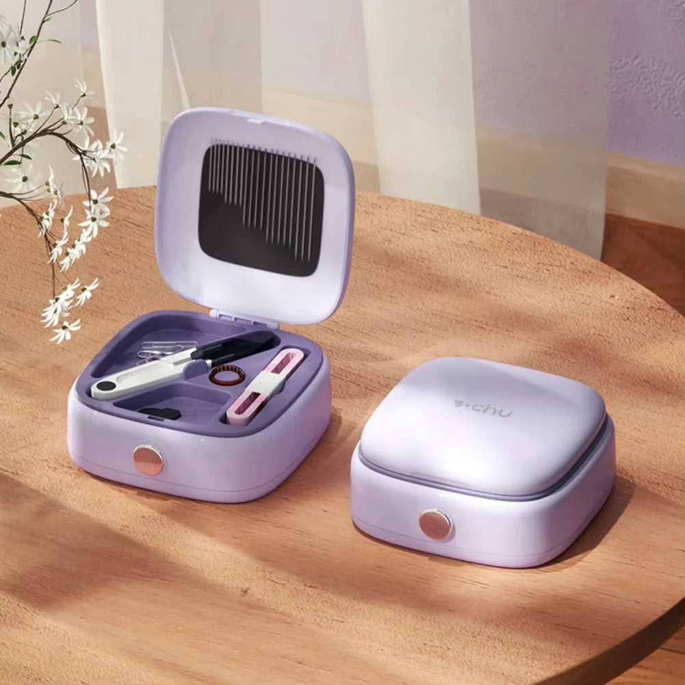 A light purple magnetic sewing kit with a lid open, displaying various needles and thread inside.