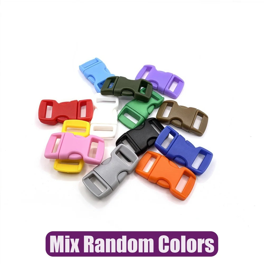 A collection of various colored adjustable plastic paracord buckle bracelets scattered on a white background.