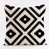 A throw pillow cover featuring a geometric black and white diamond pattern.