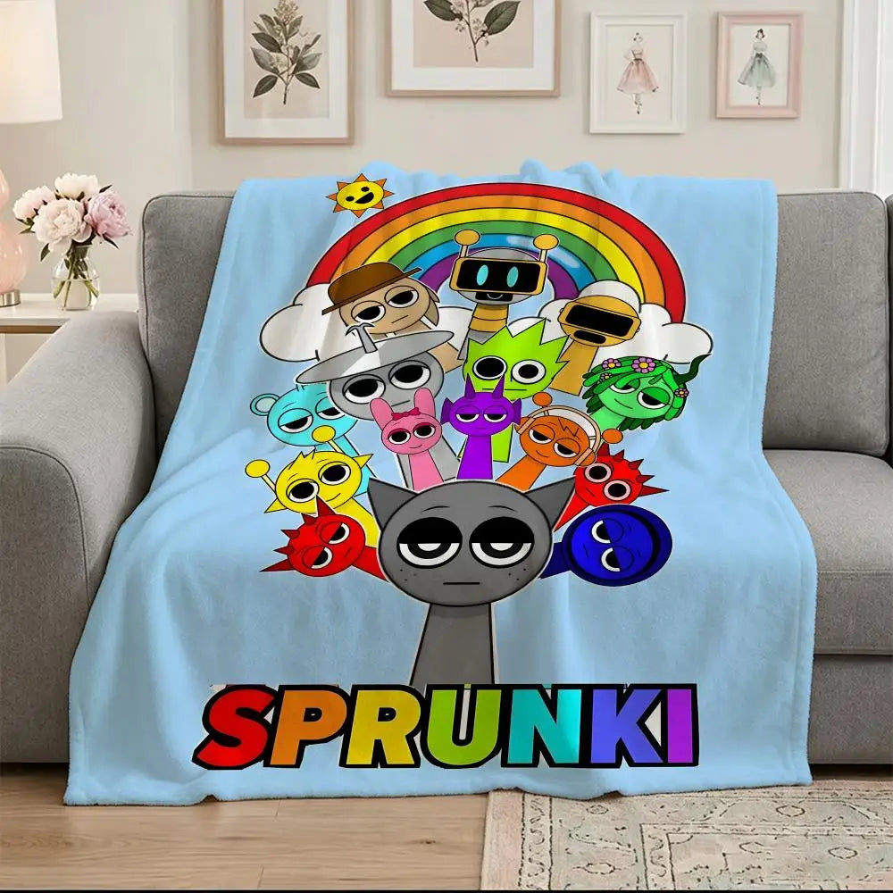 A light blue blanket featuring a colorful rainbow design with cartoon characters and the word SPRUNKI.