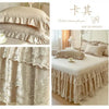 Lace ruffled bed skirt set featuring sheer fabric and delicate floral embroidery in beige color.