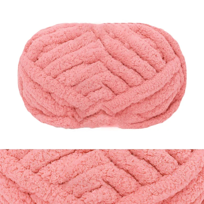A pink hand-knitted wool finger line scarf in a textured, ribbed pattern.