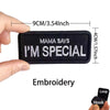 Black embroidered patch with white text saying Mama Says I'm Special