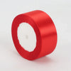 A roll of bright red satin ribbon, 4cm wide, used for crafts and gift wrapping.