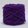 A ball of purple chenille knitting yarn used for hand crafting.