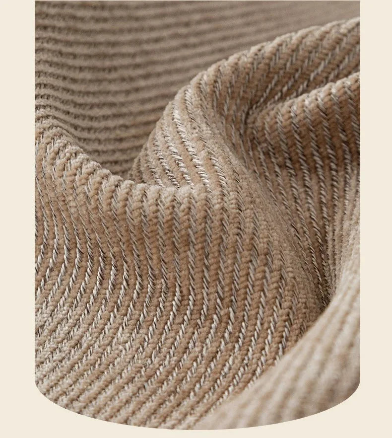 Close-up of a beige chenille sofa protector cover showing the textured weave and folds.
