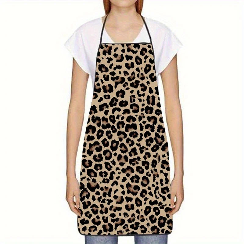 A woman wearing a sleeveless leopard print kitchen apron over a white shirt.