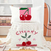 A white cushion cover featuring a graphic design of red cherries and green leaves.