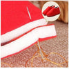 A red fabric case with white padding and a wooden needle is shown next to a pair of red shoes.