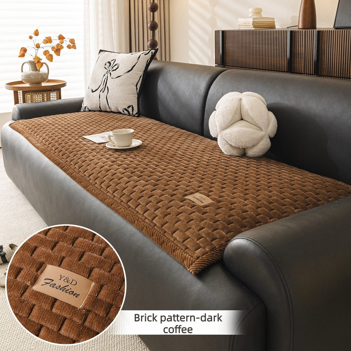 Dark brown brick pattern sofa cover with a cream cushion and decorative pillows.
