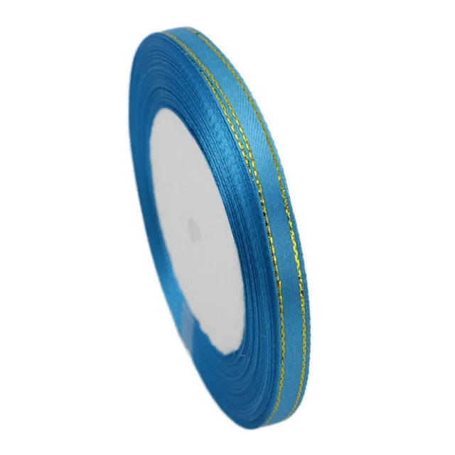 Roll of 6mm gold-edged satin ribbon in bright blue for gift wrapping and crafts