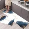 A long rectangular rug featuring a navy blue and gold diamond print placed on a light wood floor.