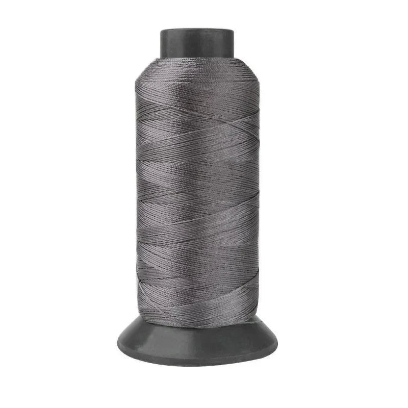 A roll of heavy duty 3-ply nylon sewing thread with a dark gray color.