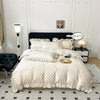 A white Korean lace duvet cover set displayed on a bed with black bedding and light gray flooring.