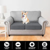 A gray sofa seat cushion cover with a dog sitting on it, showing features like pet-friendly and washable.