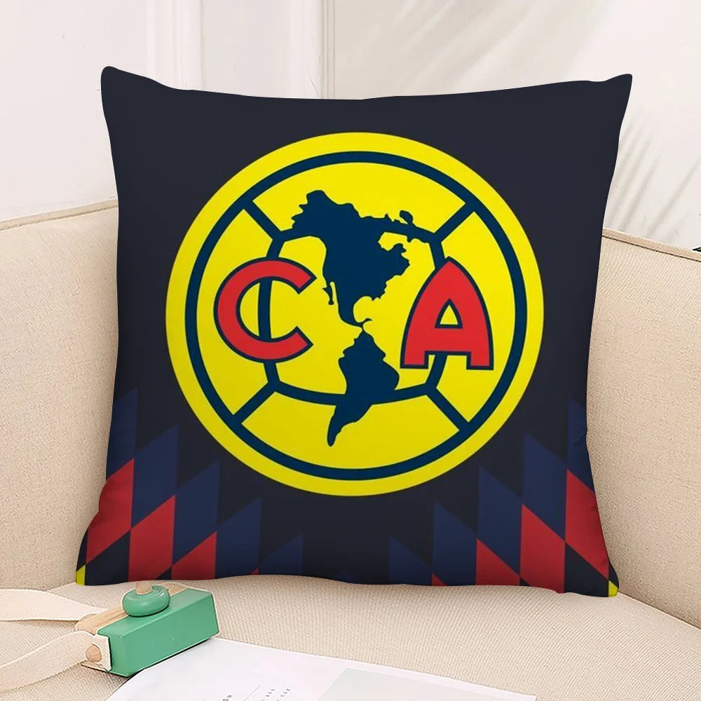 A dark blue decorative pillow featuring a yellow circle with the letters CA inside.