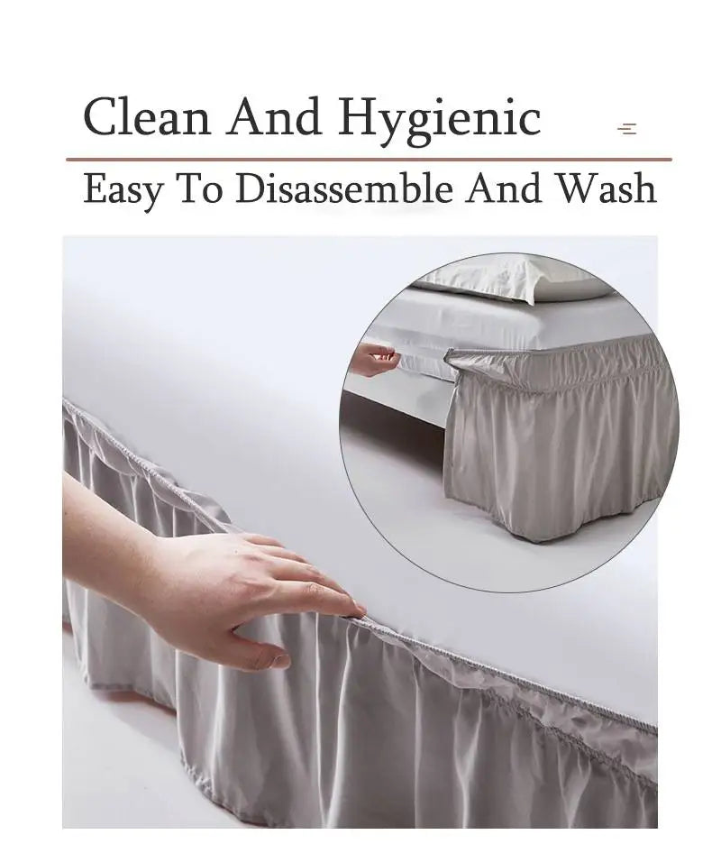 A hand is holding a light gray ruffled bed skirt, demonstrating its easy to disassemble and wash feature.