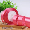 Roll of 4 cm wide satin ribbon in pink for gift wrapping and DIY crafts