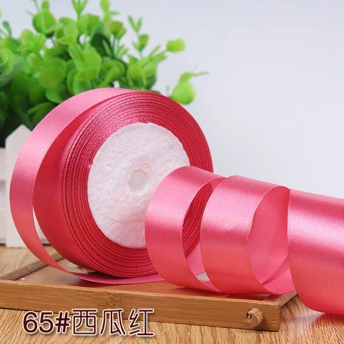 Roll of 4 cm wide satin ribbon in pink for gift wrapping and DIY crafts