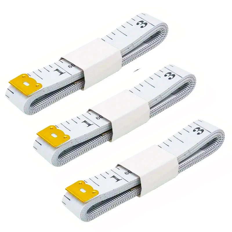A set of two flexible body measuring tapes with white and gray markings and yellow grips.