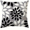 A square pillowcase cover featuring a modern geometric print pattern in black, white, and gray leaves.