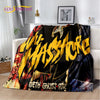 A black and yellow flannel throw blanket featuring a graphic design with text and abstract elements.